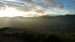 The joy of mountain hiking - seeing sunrise over the mountains. Shot in northern Taiwan