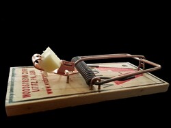 Isolated mousetrap before black background