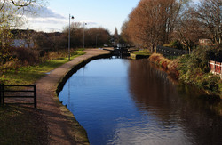 View Along A Canal: View from a bridge on a canal in Manchester