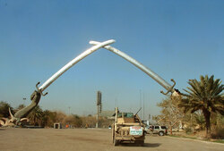 Saddam crossed swords, people drive under them when entering the safe zone