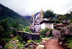Mani stones rocks with Buddhist texts inscribed, not far from Jiri, on the Jiri to Everest Base Camp trek in Nepal