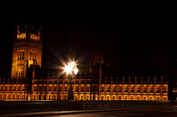 Houses of Parliament with street lamp at night - London