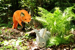 Huge lego fox stalking bunny on display at Cleveland Botanical Gardens