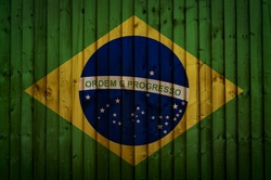 Brazilian Flag painted on old wood plank background