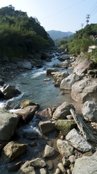 A mountain stream, or small river, in the district of Wanli, New Taipei, Taiwan, close to the Yangmingshan National Park