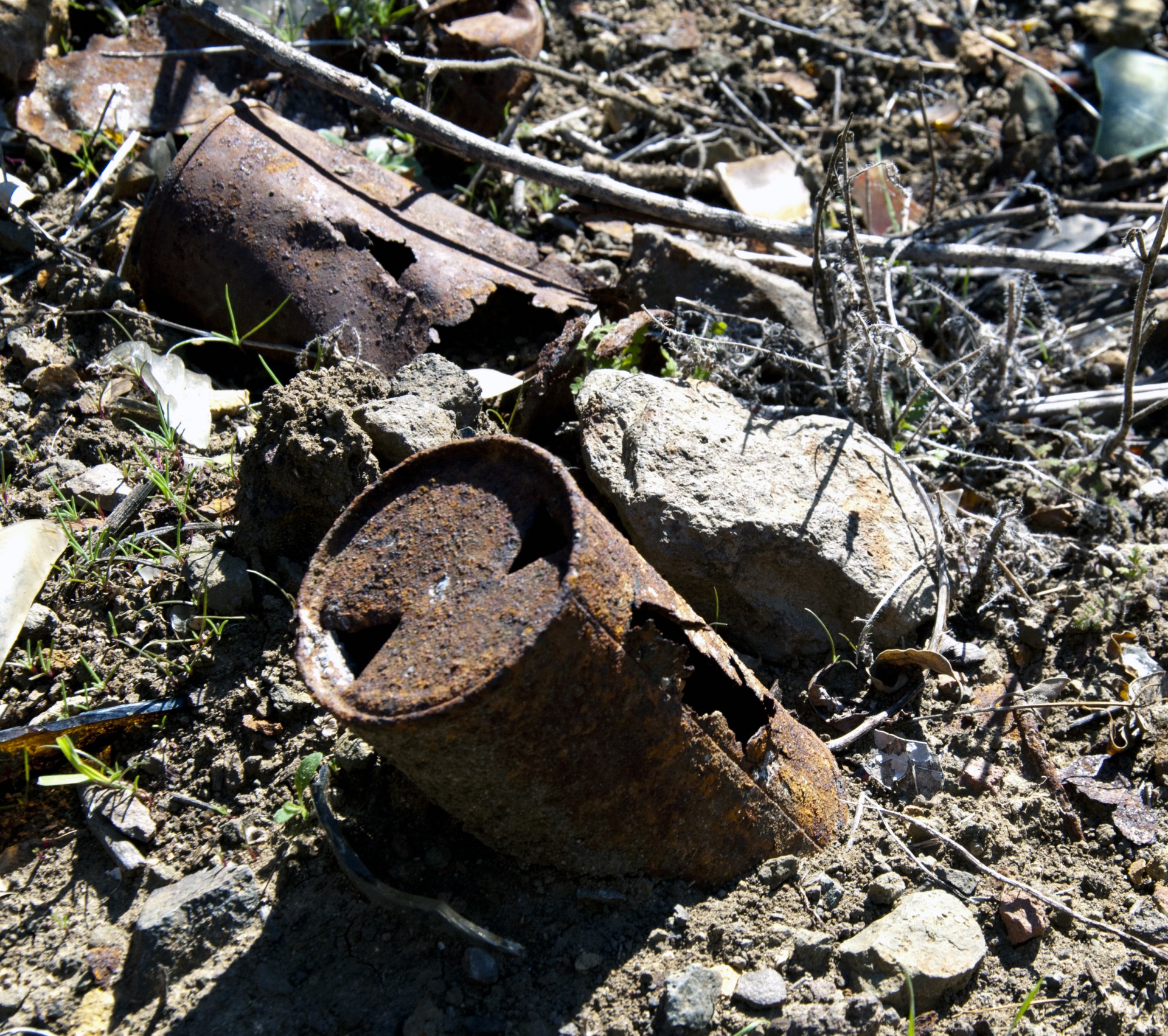 Old tin can with diamond-shaped hole punch at the top