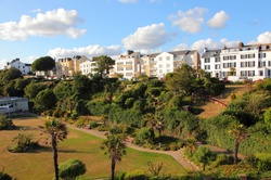 Seaside hotels on a summers day with green gardens