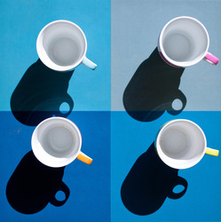 Four coffee cups, blue, orange, green and pink on a checked background