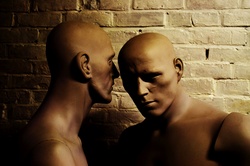 Two male mannequins whispering