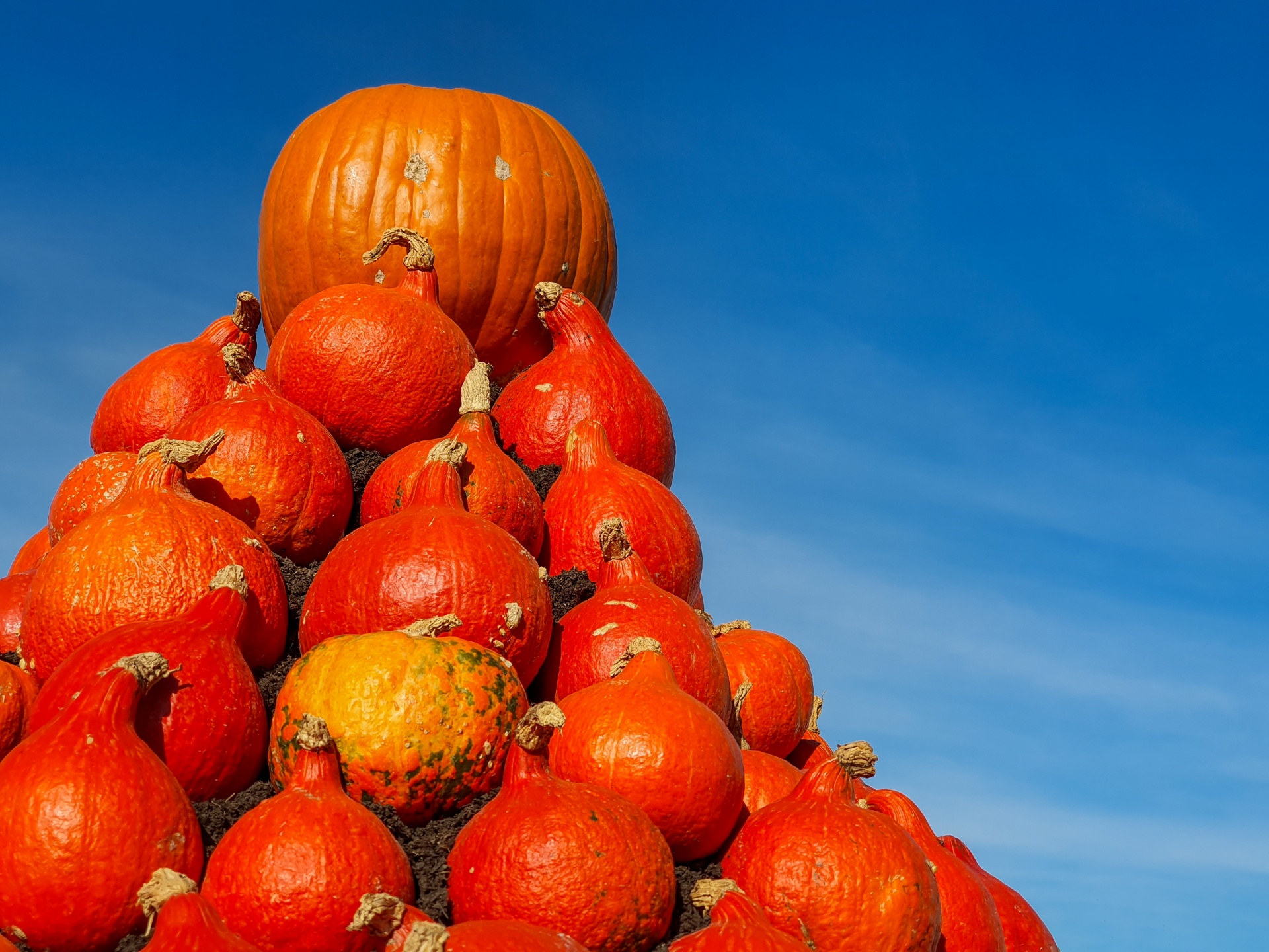 Pumpkin pyramid against blue sky