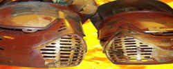 Photo of two paint ball helmets with flames