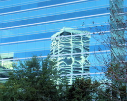 Office building reflection in office building windows
