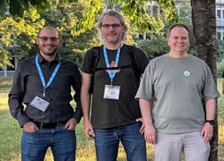 Nate Graham (left) with former KDE e.V. board member Neofytos Kolokotronis, and KDE e.V. Treasurer and VP Eike Hein at Akademy 2024. Source: KDE