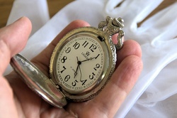 Broken time with old pocket watch