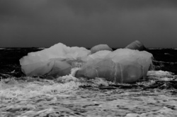 Melting iceberg in black and white