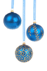 Blue Christmas Baubles: Three blue Christmas baubles hanging isolated on white background