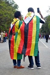 A couple taking selfies and videos during the not a coup march in Zimbabwe