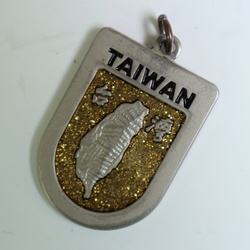 Metal pendant from Taiwan isolated on white background
