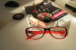 Red glasses on a white table