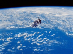 NASA Space Shuttle Astronaut performing extravehicular activity in space