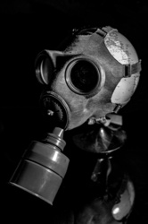 Gas Mask On Globe Of Earth in Shadow