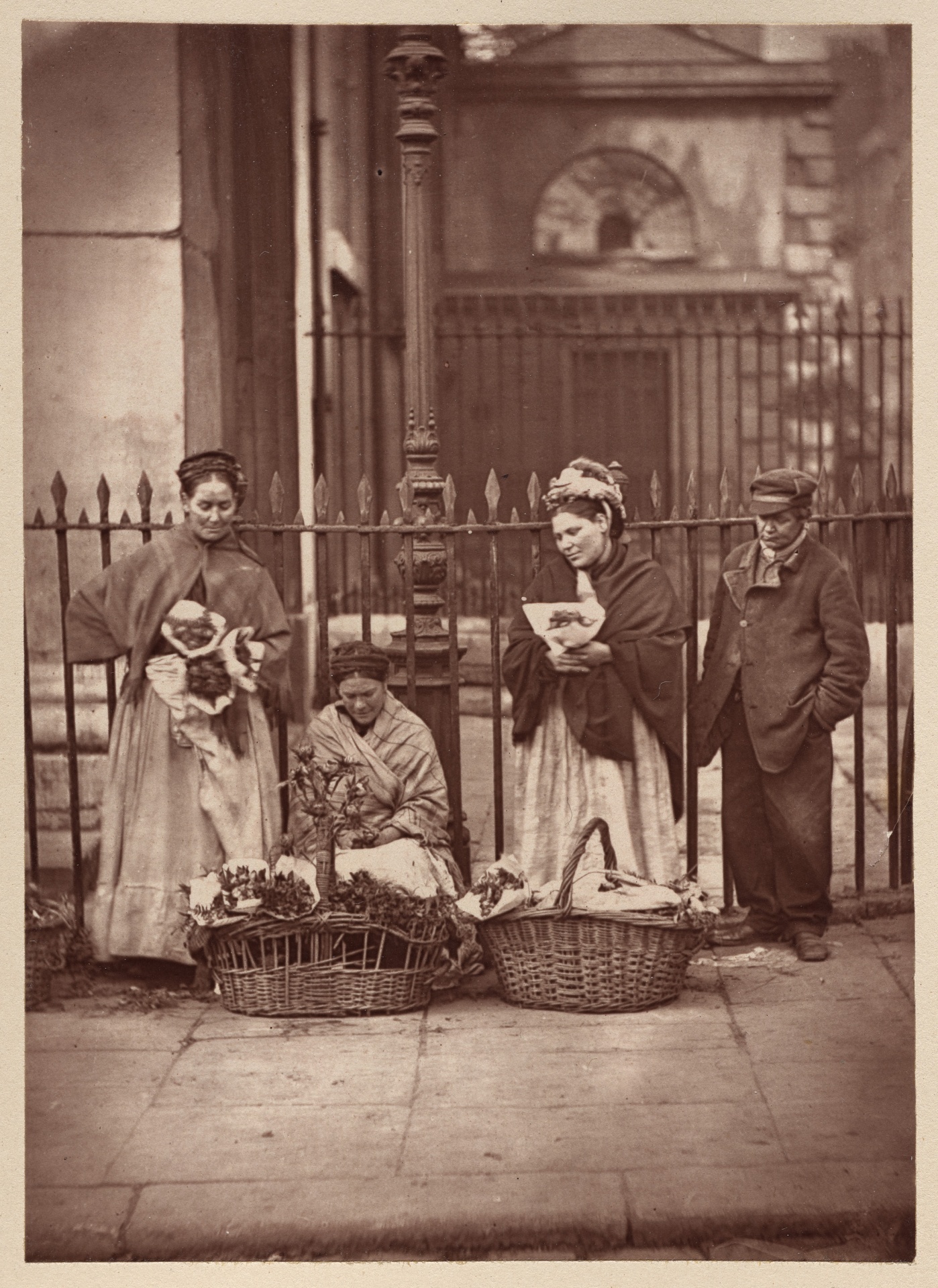 Vintage black and white photo depicting street life in London, Covent Gardens, England in 1877