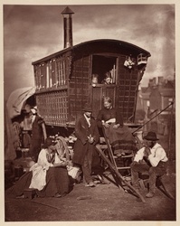 Vintage black and white photo depicting street life in London, England in 1877