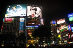 Neon signs and video screens on high-rise buildings in Tokyo, Japan.