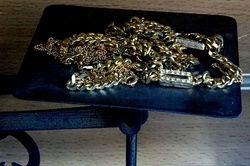 Assorted Gold Items On Weighing Scales