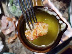 Dipping Lobster into melted Garlic Butter