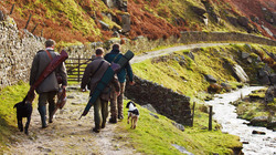 Hunters going home with some pheasants after the hunt