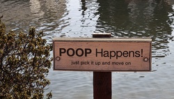 Sign that reminds folks to pick up after their dogs