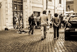 Beggar dog and his friend in Rome Italy