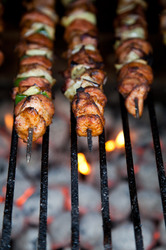 Kebab on skewers roasting on fire