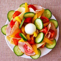 Vegetable with ham and egg on the plate