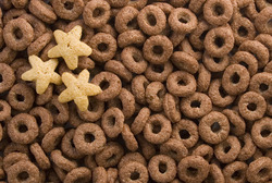 Hundreds of chocolate rings with three yellow stars ideal as a background