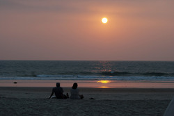 Couple on Benaulim beach, South Goa at Sunset