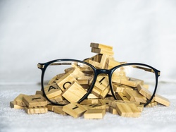 Clarity, focus and thought with glasses and scrabble tiles