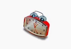 An old alarm clock from days gone by on a white background, clipart