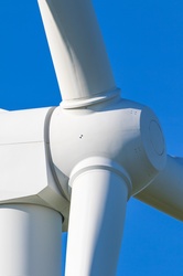 Wind turbine detail against blue sky