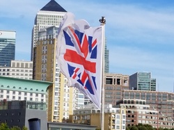British flag with city of London in background