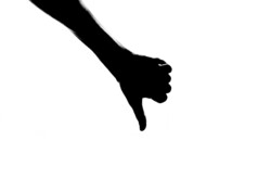 Silhouette hand thumb down isolated on the white background