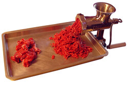 Hand grinding meat, white background