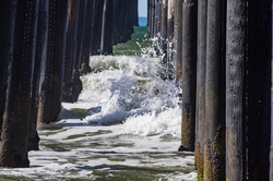 Waves hitting pier pilings