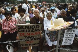 A march to protest inflation, unemployment and high taxes stopped along...