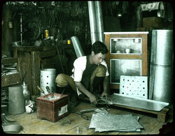 Tinsmith at work.