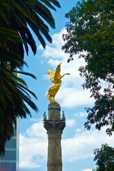 Independence Monument topped with an Angel Statue stands in the center of Mexico City.