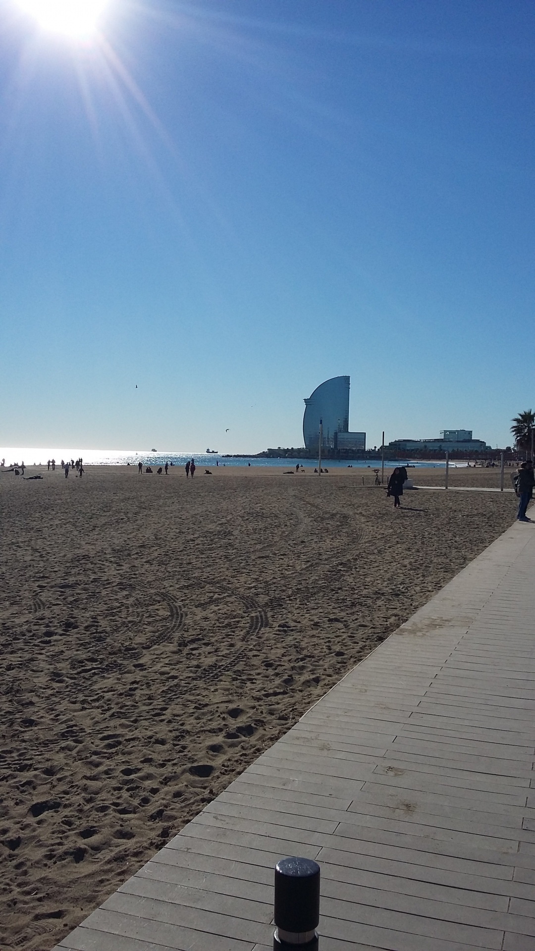 On the beach on a sunny day in Barcelona, Spain.