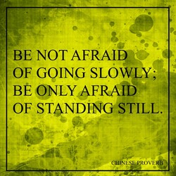 Ancient Chinese proverb printed on grunge vintage cardboard be not afraid of going slowly