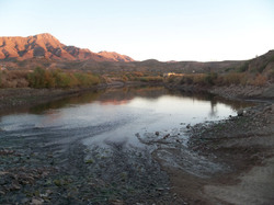 Sunset in autumn on the Rio Grande with Turtleback Mountain in background New Mexico
